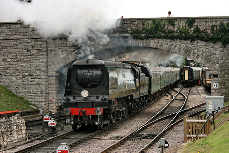 Battle of Britain Class Steam Loco No 34070 'Manston' departs Swanage Station on the Swanage Railway - Corfe Castle, Dorset, UK - 18th August 2009のeditorial素材