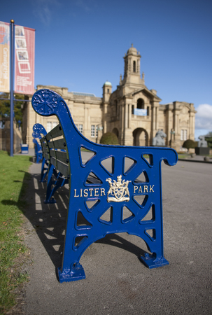 Lister Park bench with Bradford Council crest and insignia outside Cartwright Hall Museum and Art Galleryのeditorial素材