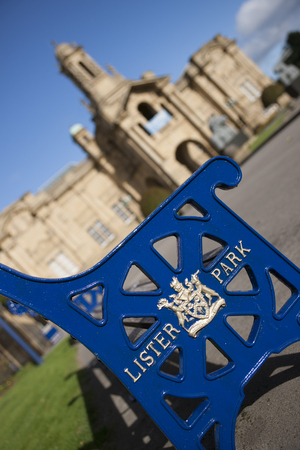 Lister Park bench with Bradford Council crest and insignia outside Cartwright Hall Museum and Art Galleryのeditorial素材