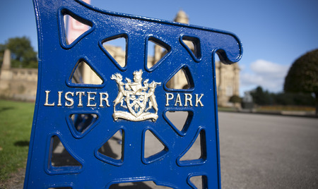 Lister Park bench with Bradford Council crest and insignia outside Cartwright Hall Museum and Art Galleryのeditorial素材