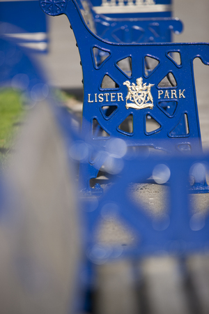 Lister Park bench with Bradford Council crest and insignia outside Cartwright Hall Museum and Art Galleryのeditorial素材