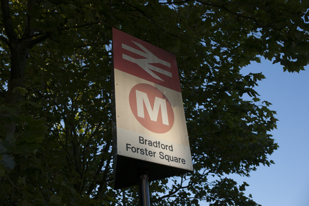 Bradford Forster Square Railway sign with Network Rail and Metro network logos against foliage. Taken September 2013のeditorial素材