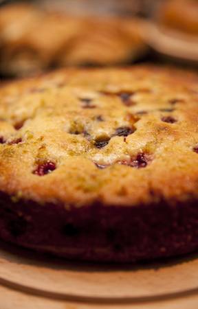 Berry and Currant Fruit Sponge country slice Cake in a cafe coffee shopの写真素材