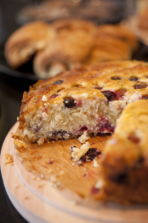 Berry and Currant Fruit Sponge country slice Cake in a cafe coffee shopの写真素材