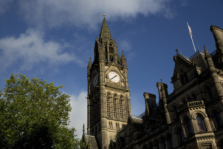 Manchester Town Hall in Albert Square against a blue sky. Manchester, UK - 29th October 2013