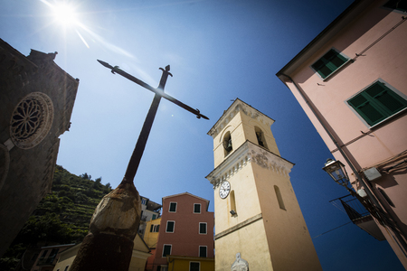 Crucifix outside the church in the hilltop square of Manarola, one of the five Cinque Terre villages - Manarola, La Spezia, Italy - 16th May 2016のeditorial素材