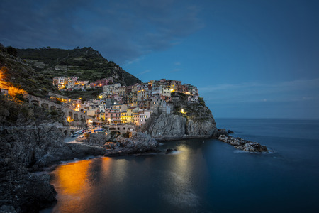 A view of the Cinque Terre village Manarola at dusk in La Spezia, Liguria, Italy - 16th May 2016の写真素材