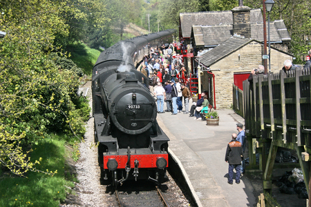 War Department Steam Locomotive 90733 arrives at the Platform, Haworth Station, Haworth, West Yorkshire, UK - 16th May 2010のeditorial素材