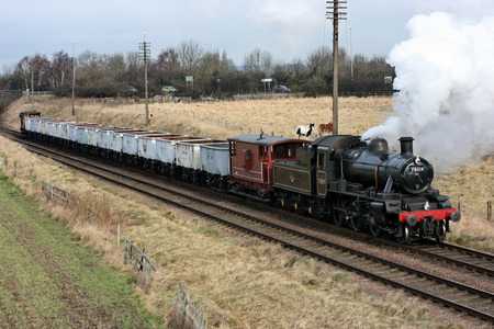 Standard 78019 steam loco with the windcutter train at the Great Central Railway Heritage Steam Railway, Loughborough, Leicestershire, United Kingdom - 21st March 2010.のeditorial素材
