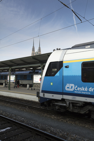 A train with Brno cathedral in the background at Brno Station, Czech Republic - 20th February 2018のeditorial素材