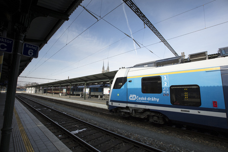 A train with Brno cathedral in the background at Brno Station, Czech Republic - 20th February 2018のeditorial素材