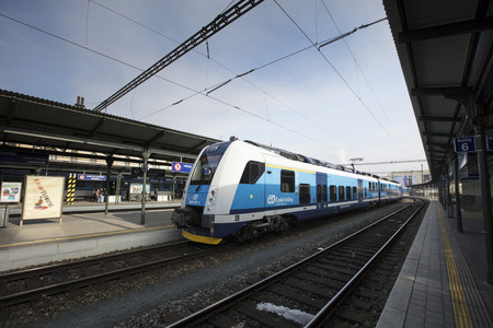 A train with Brno cathedral in the background at Brno Station, Czech Republic - 20th February 2018のeditorial素材
