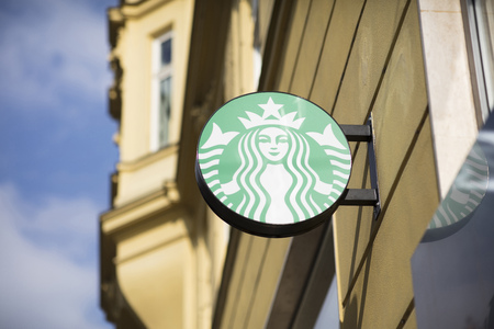 Starbucks signage on a cafe in Brno, Czech Republic, 24th February 2018のeditorial素材