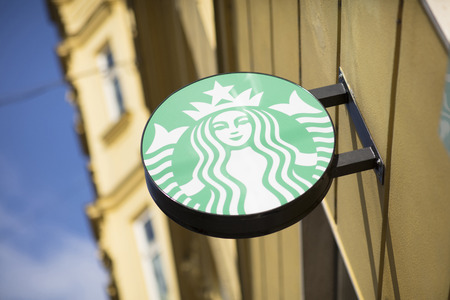 Starbucks signage on a cafe in Brno, Czech Republic, 24th February 2018のeditorial素材
