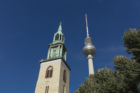 Berlin, Germany - 17th August 2018: Marienkirche and the Fernsehturm TV Tower near Alexanderplatzのeditorial素材