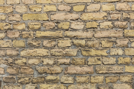 Yellow brown brick wall texture with light grey pointingのeditorial素材