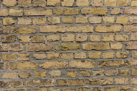 Yellow brown brick wall texture with light grey pointingのeditorial素材