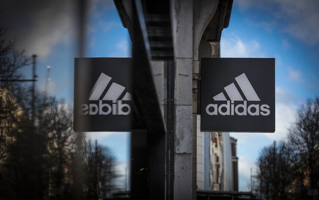 London, Greater London, United Kingdom, 7th February 2018, A sign and logo for an adidas footwear and sports shopのeditorial素材