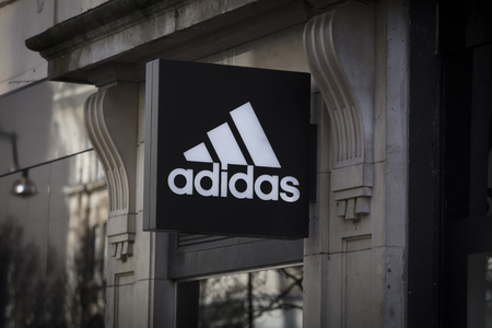 London, Greater London, United Kingdom, 7th February 2018, A sign and logo for an adidas footwear and sports shopのeditorial素材