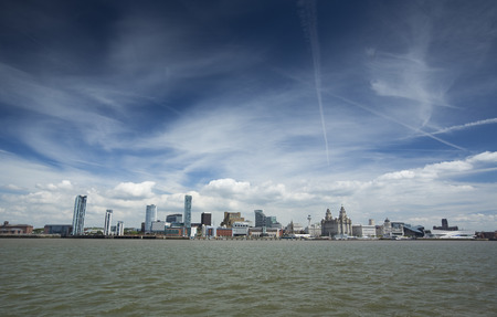 Liverpool, June 2014,  a scene across the River Mersey showing Pier Head, with the Royal Liver Building, Cunard Building and Port of Liverpool Buildingのeditorial素材