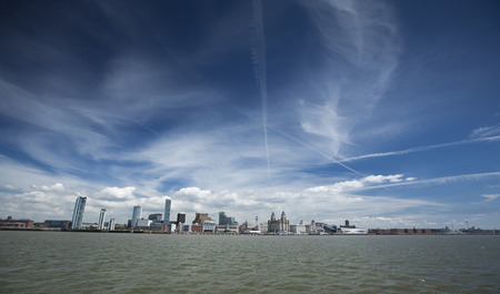 Liverpool, June 2014,  a scene across the River Mersey showing Pier Head, with the Royal Liver Building, Cunard Building and Port of Liverpool Buildingのeditorial素材