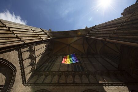 Peterborough, Cambridgeshire, United Kingdom, July 2019, A view of a Pride flag hanging from Peterborough Cathedralのeditorial素材