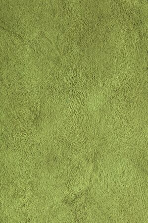Lime green Textured Rendered Wall - Stucco / Fresco effect with small ripples and chipsの写真素材