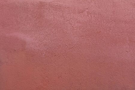 Pink Textured Rendered Wall - Stucco / Fresco effect with small ripples and chipsの写真素材