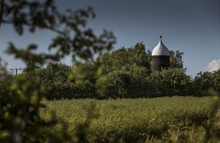 Lincolnshire, East Midlands, UK, May 2019, View of the lincolnshire countryside and an old windmill...