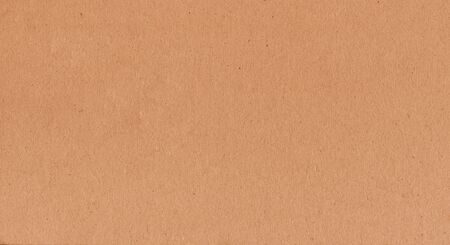 A fibrous card background with lots of texture in orangeの写真素材