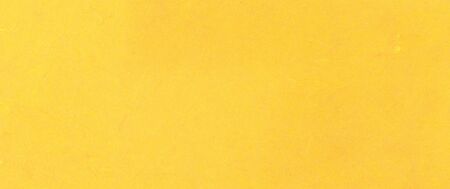 A fibrous paper with lots of texture in yellowの写真素材