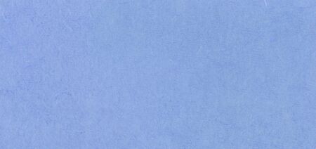 A fibrous paper with lots of texture in blueの写真素材