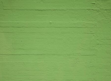 Textured concrete wall painted greenの写真素材