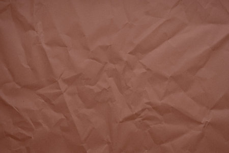 Abstract copper paper wrinkled or crumpled texture background close-up top view, copper texture, rumpled copper paper. Abstract paper background and wallpaper. Material for gift wrapping. craft materialの写真素材