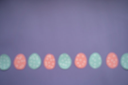 Blurred image to implement design ideas. Easter background with eggs, option 3. Copy space. vertical orientation. Flat lay, top view. Very Peri background color.の写真素材