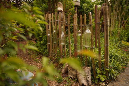 Fence made of woven branches to create an environmentally sustainable wall in the backyard garden. selective focus.の写真素材
