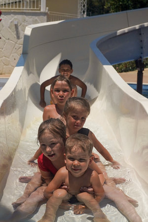 Children have fun in the water park. Family Summer Vacation, welcome to our hotel, be our guest.