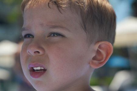 The face of a worried child is very close-up.