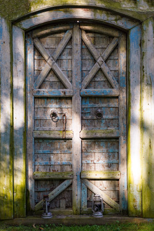 An old mysterious door in the garden. Overgrown Secret Garden Doorの写真素材