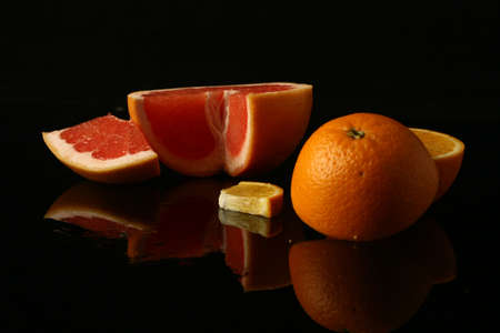 still life with slices of orange and grapefruitの写真素材
