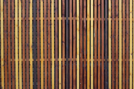 background cute multicolored wooden vertical fence rails.の写真素材