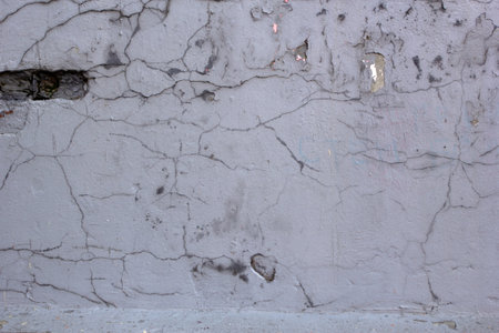Abstract background is an old ruined white wall.の写真素材