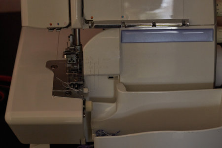 photo of the sewing machine platform coverlock and overlock. Cutting knives and needles. Sewing production. home tailoring. product. tailor.の写真素材