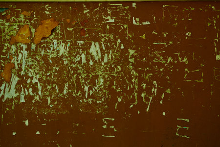 Photography abstract background brown shabby wall with remnants of paper. Screensaver, texture.の写真素材