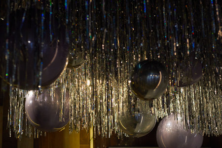 ceiling with silver balloons and foil rain.の写真素材
