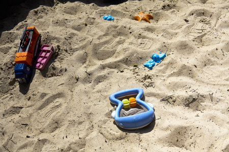 children toys in the sandbox, summer, good weatherの写真素材