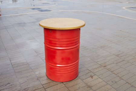 red metal barrel table in a cafe.の写真素材