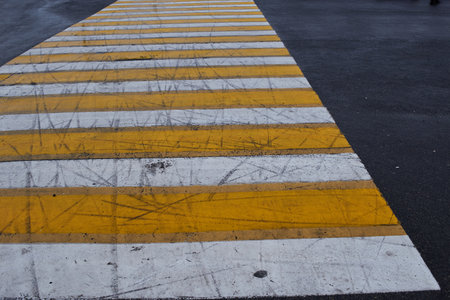 pedestrian crossing, white and yellow stripesの写真素材