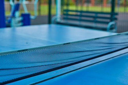 A table tennis table and a net in close-up.の写真素材