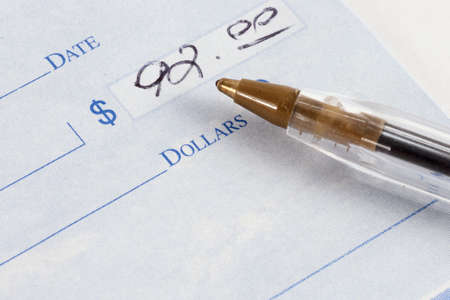 Check and pen to write out paymentの写真素材
